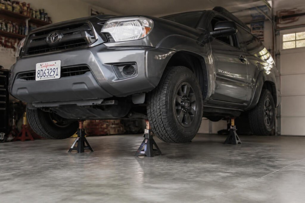 vehicle safely raised and supported on jack stands ready for maintenance work